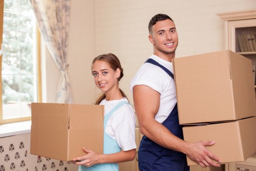 Furniture being carried down stairs in a Clapham flat move