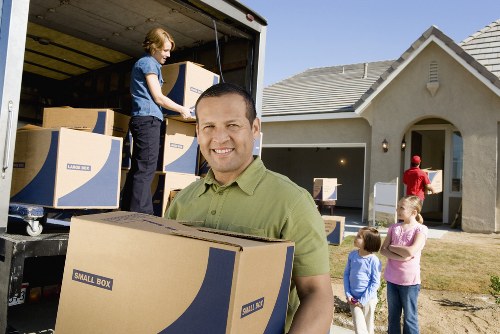 Packed boxes and furniture protection materials ready for a Clapham home relocation