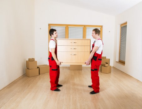 Loading furniture and boxes into a local moving vehicle in Clapham